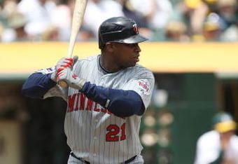 OAKLAND, CA - JUNE 11: Delmon Young #21 of the Minnesota Twins bats against the Oakland Athletics during a Major League Baseball game on June 11, 2009 at the Oakland Coliseum in Oakland, California.  (Photo by Jed Jacobsohn/Getty Images)