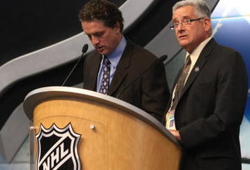 MONTREAL - JUNE 26:  Los Angeles Kings President/GM Dean Lombardi speaks at the podium as Amateur Scout - Europe Denis Fugere looks on during the first round of the 2009 NHL Entry Draft at the Bell Centre on June 26, 2009 in Montreal, Quebec, Canada. (Photo by Bruce Bennett/Getty Images)