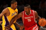LOS ANGELES, CA - MAY 12:  Ron Artest #96 of the Houston Rockets drives on Trevor Ariza #3 the first quarter of Game Five of the Western Conference Semifinals during the 2009 NBA Playoffs at Staples Center on May 12, 2009 in Los Angeles, California. NOTE TO USER: User expressly acknowledges and agrees that, by downloading and or using this photograph, User is consenting to the terms and conditions of the Getty Images License Agreement.  (Photo by Stephen Dunn/Getty Images)