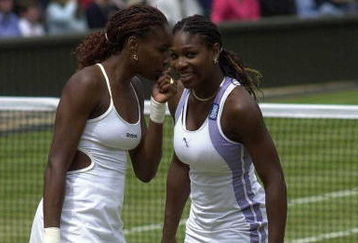 10 Jul 2000:  Venus Williams of the USA talks to her sister Serena during their match against Julie Halard-Decugis of France and Ai Sugiyama of Japan during the final of the womens doubles in the Wimbledon Lawn Tennis Championship at the All England LawnTennis and Croquet Club, Wimbledon, London. Mandatory Credit: Stu Forster/ALLSPORT