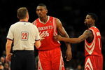 LOS ANGELES, CA - MAY 06:  Ron Artest #96 of the Houston Rockets talks with referee Bill Spooner as Artest is held back by teammate Aaron Brooks #0 before Artest was ejected in the fourth quarter against the Los Angeles Lakers in Game Two of the Western Conference Semifinals during the 2009 NBA Playoffs at Staples Center on May 6, 2009 in Los Angeles, California. NOTE TO USER: User expressly acknowledges and agrees that, by downloading and or using this photograph, User is consenting to the terms and conditions of the Getty Images License Agreement.  (Photo by Harry How/Getty Images)