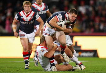 SYDNEY, AUSTRALIA - JULY 03:  Shaun Kenny-Dowall of the Roosters makes a break during the round 17 NRL match between the St George Illawarra Dragons and the Sydney Roosters at WIN Jubilee Stadium on July 3, 2009 in Sydney, Australia.  (Photo by Cameron Spencer/Getty Images)