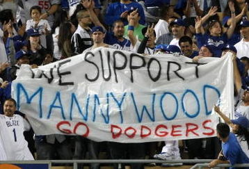 LOS ANGELES - MAY 7:  Fans hold a smuggled in banner supporting suspended Dodger Manny Ramirez during the seventh inning stretch of the game between the Los Angeles Dodgers the Washington Nationals on May 7, 2009 at Dodger Stadiium in Los Angeles, California.  All banners are prohibited in Dodger Stadium.  (Photo by Stephen Dunn/Getty Images)
