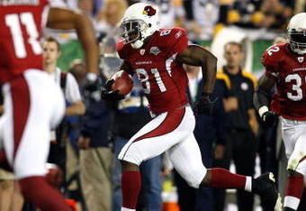 TAMPA, FL - FEBRUARY 01:  Anquan Boldin #81 of the Arizona Cardinals runs for yards after the catch as Larry Fitzgerald #11 and Edgerrin James #32 get in position to block against the Pittsburgh Steelers during Super Bowl XLIII on February 1, 2009 at Raymond James Stadium in Tampa, Florida. Steelers won 27-23. (Photo by Chris Graythen/Getty Images)