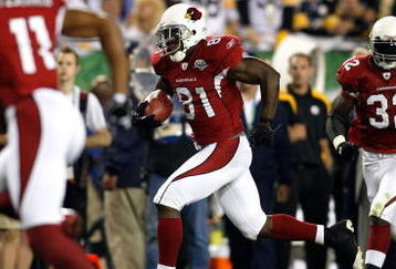TAMPA, FL - FEBRUARY 01:  Anquan Boldin #81 of the Arizona Cardinals runs for yards after the catch as Larry Fitzgerald #11 and Edgerrin James #32 get in position to block against the Pittsburgh Steelers during Super Bowl XLIII on February 1, 2009 at Raymond James Stadium in Tampa, Florida. Steelers won 27-23. (Photo by Chris Graythen/Getty Images)