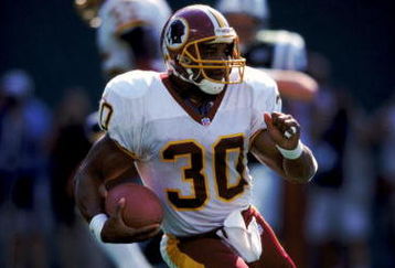 26 Sep 1999:  Brian Mitchell #30 of the Washington Redskins runs with the ball during the game against the New York Jets at the Giants Stadium in East Rutherford, New Jersey. The Redskins defeated the Jets 27-20. Mandatory Credit: Ezra O. Shaw  /Allsport
