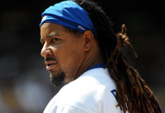 LOS ANGELES, CA - APRIL 19:  Manny Ramirez #99 of the Los Angeles Dodgers on base against the Colorado Rockies during the game at Dodger Stadium on April 19, 2009 in Los Angeles, California.  (Photo by Harry How/Getty Images)