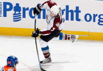 EDMONTON - OCTOBER 12:  Tyler Arnasson #9 of the Colorado Avalanche passes the puck during the game against the Edmonton Oilers on October 12, 2008 at Rexall Place in Edmonton, Alberta, Canada.  (Photo by Dale MacMillan/Getty Images)