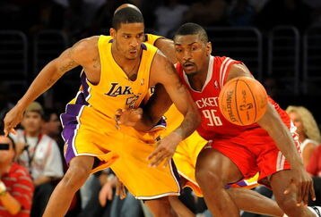LOS ANGELES, CA - MAY 06:  Trevor Ariza #3 of the Los Angeles Lakers and Ron Artest #96 of the Houston Rockets look at the ball in the second quarter of Game Two of the Western Conference Semifinals during the 2009 NBA Playoffs at Staples Center on May 6, 2009 in Los Angeles, California. NOTE TO USER: User expressly acknowledges and agrees that, by downloading and or using this photograph, User is consenting to the terms and conditions of the Getty Images License Agreement.  (Photo by Harry How/Getty Images)