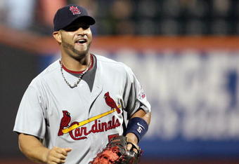 NEW YORK - JUNE 23:  Albert Pujols #5 of the St. Louis Cardinals celebrates after defeating the New York Mets at Citi Field on June 23, 2009 in the Flushing neighborhood of the Queens borough of New York City.  (Photo by Michael Heiman/Getty Images)
