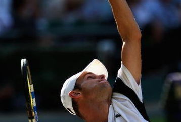 WIMBLEDON, ENGLAND - JULY 03:  Andy Roddick of USA serves during the men's singles semi final match against Andy Murray of Great Britain on Day Eleven of the Wimbledon Lawn Tennis Championships at the All England Lawn Tennis and Croquet Club on July 3, 2009 in London, England.  (Photo by Clive Brunskill/Getty Images)