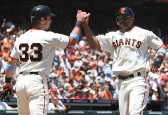 SAN FRANCISCO - JUNE 21:  Randy Winn #2 of the San Francisco Giants celebrates with Aaron Rowand #33 after scoring in the third inning against the Texas Rangers during a Major League Baseball game on June 21, 2009 at AT&T Park in San Francisco, California.  (Photo by Jed Jacobsohn/Getty Images)