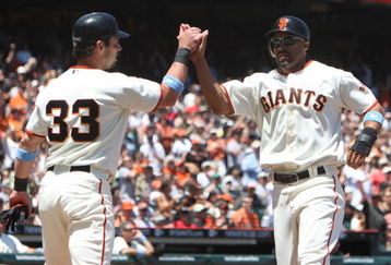 SAN FRANCISCO - JUNE 21:  Randy Winn #2 of the San Francisco Giants celebrates with Aaron Rowand #33 after scoring in the third inning against the Texas Rangers during a Major League Baseball game on June 21, 2009 at AT&T Park in San Francisco, California.  (Photo by Jed Jacobsohn/Getty Images)