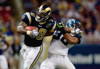 ST. LOUIS, MO - DECEMBER 14:  Steven Jackson #39 of the St. Louis Rams carries the ball as he blocks Julian Peterson #98 of the Seattle Seahawks at the Edward Jones Dome on December 14, 2008 in St. Louis, Missouri.  (Photo by: Dilip Vishwanat/Getty Images)
