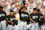 MIAMI - APRIL 10:  (L-R) Dontrelle Willis #35, Manager Jack McKeon #15, Miguel Cabrera #24, Jeff Conine #18 and Alex Gonzalez #11 of the Florida Marlins smile and acknowledge the fans after receiving their 2003 World Series Championship rings prior to the game against the Philadelphia Phillies at Pro Player Stadium on April 10, 2004 in Miami, Florida. The Marlins won 5-3.  (Photo by Victor Baldizon/Getty Images)