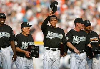 MIAMI - APRIL 10:  (L-R) Dontrelle Willis #35, Manager Jack McKeon #15, Miguel Cabrera #24, Jeff Conine #18 and Alex Gonzalez #11 of the Florida Marlins smile and acknowledge the fans after receiving their 2003 World Series Championship rings prior to the game against the Philadelphia Phillies at Pro Player Stadium on April 10, 2004 in Miami, Florida. The Marlins won 5-3.  (Photo by Victor Baldizon/Getty Images)