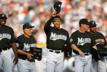 MIAMI - APRIL 10:  (L-R) Dontrelle Willis #35, Manager Jack McKeon #15, Miguel Cabrera #24, Jeff Conine #18 and Alex Gonzalez #11 of the Florida Marlins smile and acknowledge the fans after receiving their 2003 World Series Championship rings prior to the game against the Philadelphia Phillies at Pro Player Stadium on April 10, 2004 in Miami, Florida. The Marlins won 5-3.  (Photo by Victor Baldizon/Getty Images)