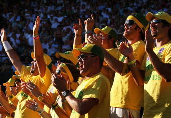 WIMBLEDON, ENGLAND - JULY 01:  Fans support Lleyton Hewitt of Australia during his men's singles quarter final match against Andy Roddick of USA on Day Nine of the Wimbledon Lawn Tennis Championships at the All England Lawn Tennis and Croquet Club on July 1, 2009 in London, England.  (Photo by Hamish Blair/Getty Images)