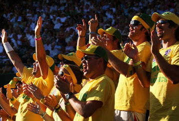 WIMBLEDON, ENGLAND - JULY 01:  Fans support Lleyton Hewitt of Australia during his men's singles quarter final match against Andy Roddick of USA on Day Nine of the Wimbledon Lawn Tennis Championships at the All England Lawn Tennis and Croquet Club on July 1, 2009 in London, England.  (Photo by Hamish Blair/Getty Images)