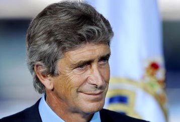 MADRID, SPAIN - JUNE 02:  New Real Madrid coach Manuel Pellegrini listens to a word of welcome by Real Madrid president Florentino Perez during his presentation at the Santiago Bernabeu stadium on June 2, 2009 in Madrid, Spain. The 55-year-old former Villarreal coach Pellegrini has signed a two-year deal with Los Merengues.  (Photo by Jasper Juinen/Getty Images)