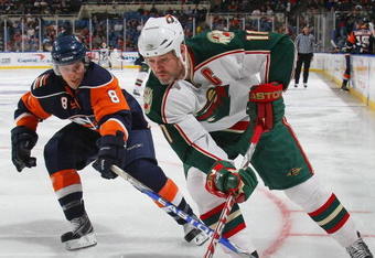 UNIONDALE, NY - MARCH 25:  Owen Nolan #11 of the Minnesota Wild skates against the New York Islanders on March 25, 2009 at the Nassau Coliseum in Uniondale, New York.  (Photo by Bruce Bennett/Getty Images)