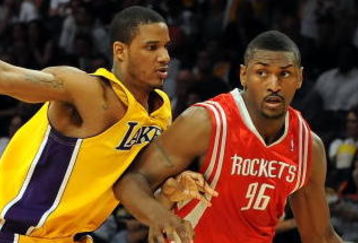 LOS ANGELES, CA - MAY 06:  Ron Artest #96 of the Houston Rockets moves the ball against Trevor Ariza #3 of the Los Angeles Lakers in Game Two of the Western Conference Semifinals during the 2009 NBA Playoffs at Staples Center on May 6, 2009 in Los Angeles, California. NOTE TO USER: User expressly acknowledges and agrees that, by downloading and or using this photograph, User is consenting to the terms and conditions of the Getty Images License Agreement.  (Photo by Harry How/Getty Images)