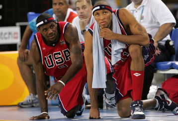 ATHENS - AUGUST 15:  Lebron James #9 (L) and Shawn Marion #11 of the United States watch the final moments of their loss to Puerto Rico in the men's basketball preliminary game on August 15, 2004 during the Athens 2004 Summer Olympic Games at the Indoor Arena of the Helliniko Olympic Complex in Athens, Greece. Puerto Rico won 92-73. (Photo by Jamie Squire/Getty Images)