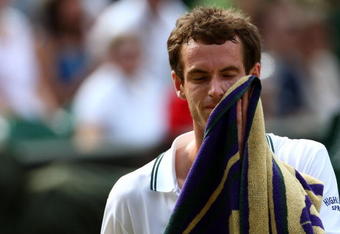 WIMBLEDON, ENGLAND - JULY 03:  Andy Murray of Great Britain looks thoughtful during the men's singles semi final match against Andy Roddick of USA on Day Eleven of the Wimbledon Lawn Tennis Championships at the All England Lawn Tennis and Croquet Club on July 3, 2009 in London, England.  (Photo by Clive Brunskill/Getty Images)