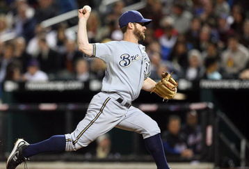 NEW YORK - APRIL 17:  Dave Bush #31 of the Milwaukee Brewers deals a pitch against the New York Mets on April 17, 2009 at Citi Field in the Flushing neighborhood of the Queens borough of New York City.  (Photo by Jim McIsaac/Getty Images)