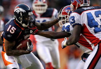 DENVER - DECEMBER 21:  Wide receiver Brandon Marshall #15 of the Denver Broncos makes a reception as Terrence McGee #24 of the Buffalo Bills defends during NFL action at Invesco Field at Mile High on December 21, 2008 in Denver, Colorado. The Bills defeated the Broncos 30-23.  (Photo by Doug Pensinger/Getty Images)