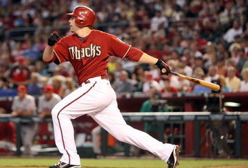 PHOENIX - JUNE 28:  Mark Reynolds #27 of the Arizona Diamondbacks hits an RBI sacrifice fly against the Los Angeles Angels of Anaheim during the first inning of the major league baseball game at Chase Field on June 28, 2009 in Phoenix, Arizona.  (Photo by Christian Petersen/Getty Images)