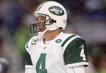 SEATTLE - DECEMBER 21:  Quarterback Brett Favre #4 of the New York Jets warms his hands during the game against the Seattle Seahawks on December 21, 2008 at Qwest Field in Seattle, Washington. The Seahawks defeated the Jets 13-3. (Photo by Otto Greule Jr/Getty Images)