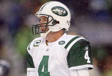 SEATTLE - DECEMBER 21:  Quarterback Brett Favre #4 of the New York Jets warms his hands during the game against the Seattle Seahawks on December 21, 2008 at Qwest Field in Seattle, Washington. The Seahawks defeated the Jets 13-3. (Photo by Otto Greule Jr/Getty Images)