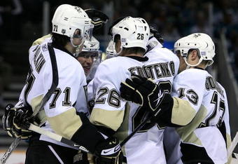 SAN JOSE, CA - OCTOBER 28:  (L-R) Evgeni Malkin #71, Sidney Crosby #87 and Alex Goligoski #13 of the Pittsburgh Penguins congratulate Ruslan Fedotenko #26 after Fedotenko scored a third period goal against the San Jose Sharks during the NHL game at HP Pavilion on October 28, 2008 in San Jose, California.  The Sharks defeated the Penguins 2-1. (Photo by Christian Petersen/Getty Images)