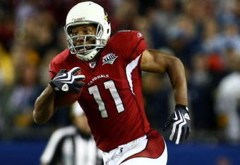 TAMPA, FL - FEBRUARY 01:  Wide receiver Larry Fitzgerald #11 of the Arizona Cardinals scores a 64-yard touchdown reception in the fourth quarter against the Pittsburgh Steelers during Super Bowl XLIII on February 1, 2009 at Raymond James Stadium in Tampa, Florida.  (Photo by Chris McGrath/Getty Images)
