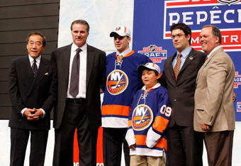 MONTREAL, QC - JUNE 26:  (L-R) Team owner Charles Wang, General Manger Garth Snow, John Tavares, Assistant General Manager/Director of Amateur Scouting Ryan Jankowski and Pro Scout Mario Saraceno of the New Islanders pose on stage after the Islanders drafted Tavares #1 overall during the 2009 NHL Entry Draft by the New York Islander at the Bell Centre on June 26, 2009 in Montreal, Quebec, Canada.  (Photo by Richard Wolowicz/Getty Images)