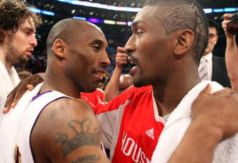 LOS ANGELES, CA - MAY 17:  Kobe Bryant #24 of the Los Angeles Lakers hugs Ron Artest #96 of the Houston Rockets after the Lakers defeated the Rockets 89-70 in Game Seven of the Western Conference Semifinals during the 2009 NBA Playoffs at Staples Center on May 17, 2009 in Los Angeles, California. NOTE TO USER: User expressly acknowledges and agrees that, by downloading and or using this photograph, User is consenting to the terms and conditions of the Getty Images License Agreement.  (Photo by Stephen Dunn/Getty Images)