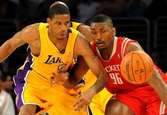 LOS ANGELES, CA - MAY 06:  Trevor Ariza #3 of the Los Angeles Lakers and Ron Artest #96 of the Houston Rockets look at the ball in the second quarter of Game Two of the Western Conference Semifinals during the 2009 NBA Playoffs at Staples Center on May 6, 2009 in Los Angeles, California. NOTE TO USER: User expressly acknowledges and agrees that, by downloading and or using this photograph, User is consenting to the terms and conditions of the Getty Images License Agreement.  (Photo by Harry How/Getty Images)