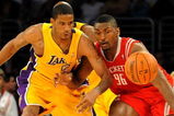 LOS ANGELES, CA - MAY 06:  Trevor Ariza #3 of the Los Angeles Lakers and Ron Artest #96 of the Houston Rockets look at the ball in the second quarter of Game Two of the Western Conference Semifinals during the 2009 NBA Playoffs at Staples Center on May 6, 2009 in Los Angeles, California. NOTE TO USER: User expressly acknowledges and agrees that, by downloading and or using this photograph, User is consenting to the terms and conditions of the Getty Images License Agreement.  (Photo by Harry How/Getty Images)