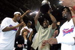 AUBURN HILLS, MI - JUNE 1:  (L-R) Chauncey Billups #1, Rasheed Wallace #30, President of Basketball Operations Joe Dumars (holding trophy) and Ben Wallace #3 of the Detroit Pistons celebrate their win over the Indiana Pacers in Game six of the Eastern Conference Finals during the 2004 NBA Playoffs at The Palace of Auburn Hills on June 1, 2004 in Auburn Hills, Michigan.  The Pistons defeated the Pacers 69-65 and won the 2004 Eastern Conference Championship.  NOTE TO USER: User expressly acknowledges and agrees that, by downloading and/or using this Photograph, user is consenting to the terms and conditions of the Getty Images License Agreement. (Photo by Tom Pidgeon/Getty Images)