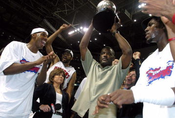 AUBURN HILLS, MI - JUNE 1:  (L-R) Chauncey Billups #1, Rasheed Wallace #30, President of Basketball Operations Joe Dumars (holding trophy) and Ben Wallace #3 of the Detroit Pistons celebrate their win over the Indiana Pacers in Game six of the Eastern Conference Finals during the 2004 NBA Playoffs at The Palace of Auburn Hills on June 1, 2004 in Auburn Hills, Michigan.  The Pistons defeated the Pacers 69-65 and won the 2004 Eastern Conference Championship.  NOTE TO USER: User expressly acknowledges and agrees that, by downloading and/or using this Photograph, user is consenting to the terms and conditions of the Getty Images License Agreement. (Photo by Tom Pidgeon/Getty Images)