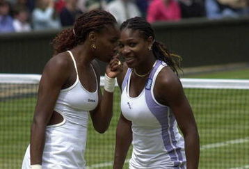 10 Jul 2000:  Venus Williams of the USA talks to her sister Serena during their match against Julie Halard-Decugis of France and Ai Sugiyama of Japan during the final of the womens doubles in the Wimbledon Lawn Tennis Championship at the All England LawnTennis and Croquet Club, Wimbledon, London. Mandatory Credit: Stu Forster/ALLSPORT