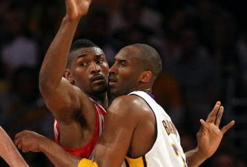 LOS ANGELES, CA - MAY 17:  Kobe Bryant #24 of the Los Angeles Lakers is covered by Ron Artest #96 of the Houston Rockets in the third quarter of Game Seven of the Western Conference Semifinals during the 2009 NBA Playoffs at Staples Center on May 17, 2009 in Los Angeles, California. NOTE TO USER: User expressly acknowledges and agrees that, by downloading and or using this photograph, User is consenting to the terms and conditions of the Getty Images License Agreement.  (Photo by Stephen Dunn/Getty Images)