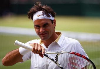 WIMBLEDON, ENGLAND - JULY 03:  Roger Federer of Switzerland smiles during the men's singles semi final match against Tommy Haas of Germany on Day Eleven of the Wimbledon Lawn Tennis Championships at the All England Lawn Tennis and Croquet Club on July 3, 2009 in London, England.  (Photo by Julian Finney/Getty Images)