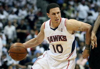 ATLANTA - APRIL 29:  Mike Bibby #10 of the Atlanta Hawks drives around James Jones #22 of the Miami Heat during Game Five of the Eastern Conference Quarterfinals at Philips Arena on April 29, 2009 in Atlanta, Georgia. The Hawks defeated the Heat 106-91. NOTE TO USER: User expressly acknowledges and agrees that, by downloading and/or using this Photograph, user is consenting to the terms and conditions of the Getty Images License Agreement.  (Photo by Doug Benc/Getty Images)