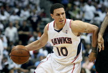 ATLANTA - APRIL 29:  Mike Bibby #10 of the Atlanta Hawks drives around James Jones #22 of the Miami Heat during Game Five of the Eastern Conference Quarterfinals at Philips Arena on April 29, 2009 in Atlanta, Georgia. The Hawks defeated the Heat 106-91. NOTE TO USER: User expressly acknowledges and agrees that, by downloading and/or using this Photograph, user is consenting to the terms and conditions of the Getty Images License Agreement.  (Photo by Doug Benc/Getty Images)