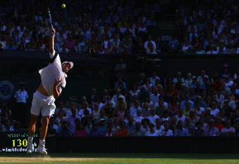 WIMBLEDON, ENGLAND - JULY 03:  Andy Roddick of USA serves during the men's singles semi final match against Andy Murray of Great Britain on Day Eleven of the Wimbledon Lawn Tennis Championships at the All England Lawn Tennis and Croquet Club on July 3, 2009 in London, England.  (Photo by Julian Finney/Getty Images)