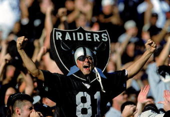 24 Oct 1999: A fan of the Oakland Raiders cheers in the stands as he wears the logo during a game against the New York Jets at the Network Coliseum in Oakland, California. The Raiders defeated the Jets 24-23. Mandatory Credit: Jon Ferrey  /Allsport