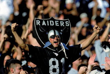 24 Oct 1999: A fan of the Oakland Raiders cheers in the stands as he wears the logo during a game against the New York Jets at the Network Coliseum in Oakland, California. The Raiders defeated the Jets 24-23. Mandatory Credit: Jon Ferrey  /Allsport