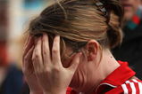 LIVERPOOL, ENGLAND - APRIL 15:  A fan reacts as she pays her respects at the Hillsborough memorial at Anfield on April 15, 2009, Liverpool, England.  Thousands of fans, friends and relatives are descending on Liverpool's Anfield Stadium to mark the 20th anniversary of the Hillsborough disaster. A total of 96 Liverpool supporters lost their lives during a crush at an FA Cup semi final against Nottingham Forest at the Hillsborough football ground in Sheffield, South Yorkshire in 1989.  (Photo by Christopher Furlong/Getty Images)